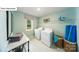Well-equipped laundry room with modern machines, ample shelving, and a bright window for convenience at 118 Fordingbridge Ln, Mooresville, NC 28115