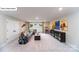 Spacious living room with a large sectional couch, movie posters, and a large cabinet for storage at 118 Fordingbridge Ln, Mooresville, NC 28115