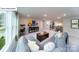 Spacious living area features large windows, modern décor, and comfortable seating for relaxing and entertaining at 118 Fordingbridge Ln, Mooresville, NC 28115