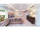 This primary bedroom features a tray ceiling, lots of natural light, and an attached bathroom with double doors at 118 Fordingbridge Ln, Mooresville, NC 28115