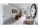 Home office with a wooden desk, carpet flooring, and a large decorative clock at 118 Fordingbridge Ln, Mooresville, NC 28115