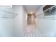 The walk-in closet features ample shelving and space to store all of your clothes and personal items at 118 Fordingbridge Ln, Mooresville, NC 28115