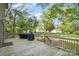 Large back deck with a grill overlooking a spacious, private backyard at 119 Lakenheath Ln, Matthews, NC 28105