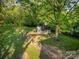 Private backyard features a storage shed, mature trees, and a fenced yard at 119 Lakenheath Ln, Matthews, NC 28105