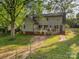 Backyard with a spacious deck overlooking a fenced in yard, perfect for entertaining at 119 Lakenheath Ln, Matthews, NC 28105