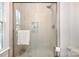 Modern walk-in shower stall with light tile and a built-in toiletry niche at 119 Lakenheath Ln, Matthews, NC 28105