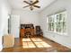 Bright bedroom features hardwood floors, natural light, and a traditional-style desk at 119 Lakenheath Ln, Matthews, NC 28105