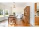 Comfortable dining room with hardwood floors and a large window at 119 Lakenheath Ln, Matthews, NC 28105