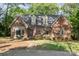 Inviting brick home with a well-kept lawn and attractive exterior details at 119 Lakenheath Ln, Matthews, NC 28105