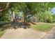Beautiful brick home nestled among mature trees, offering privacy and charm at 119 Lakenheath Ln, Matthews, NC 28105