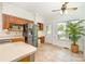 Eat-in kitchen features stainless steel appliances, tile floors, and natural light from the large window at 119 Lakenheath Ln, Matthews, NC 28105