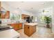 Bright kitchen featuring tile floors, oak cabinets, and white countertops at 119 Lakenheath Ln, Matthews, NC 28105
