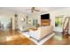 Spacious living room showcasing hardwood floors, a cozy fireplace, and stylish furnishings at 119 Lakenheath Ln, Matthews, NC 28105