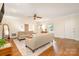 Bright living room with hardwood floors, ceiling fan, and lots of natural light at 119 Lakenheath Ln, Matthews, NC 28105