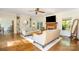 Spacious living room showcasing hardwood floors, a cozy fireplace, and stylish furnishings at 119 Lakenheath Ln, Matthews, NC 28105