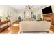 Cozy living room featuring hardwood floors, a ceiling fan, and a brick fireplace at 119 Lakenheath Ln, Matthews, NC 28105