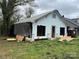 Exterior of distressed property covered in black tarp at 119 Mitchell St, Salisbury, NC 28144