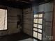 Room in need of repair with exposed structure and wires, undergoing renovation at 119 Mitchell St, Salisbury, NC 28144
