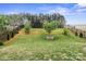 Large backyard with a manicured lawn and black metal fencing at 121 Little Kennerly Dr, Mooresville, NC 28115