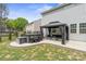Outdoor living space featuring a hot tub, covered patio, and landscaped backyard at 121 Little Kennerly Dr, Mooresville, NC 28115