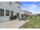 Backyard with seating, grill, and manicured lawn at 121 Little Kennerly Dr, Mooresville, NC 28115