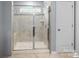 Bathroom featuring a modern glass-enclosed shower with tiled walls at 121 Little Kennerly Dr, Mooresville, NC 28115