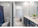 Bathroom featuring a double vanity, modern fixtures, and a decorative shower curtain at 121 Little Kennerly Dr, Mooresville, NC 28115