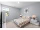 Well-lit bedroom with a cozy queen-sized bed, two nightstands, and a window at 121 Little Kennerly Dr, Mooresville, NC 28115