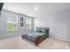 Well-lit bedroom with large windows, neutral walls and carpet flooring at 121 Little Kennerly Dr, Mooresville, NC 28115