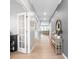 Inviting hallway featuring hardwood floors, neutral walls, and an arched entrance at 121 Little Kennerly Dr, Mooresville, NC 28115
