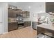 Contemporary kitchen with stainless steel appliances, dark cabinets and stone countertops at 121 Little Kennerly Dr, Mooresville, NC 28115