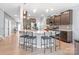 Kitchen island with bar seating, pendant lighting, and dark cabinets at 121 Little Kennerly Dr, Mooresville, NC 28115