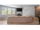 Bright living room featuring a fireplace, modern lighting and neutral colored walls at 121 Little Kennerly Dr, Mooresville, NC 28115
