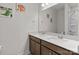 bathroom features a double sink vanity with lots of counter space and fun dinosaur artwork at 12110 Anne Blount Aly, Huntersville, NC 28078