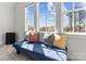 Sunlit bonus room with a plush seating area, large windows, and a view of the neighborhood at 12110 Anne Blount Aly, Huntersville, NC 28078
