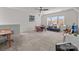 Large bonus room with a seating area, play table, ceiling fan, and lots of natural light at 12110 Anne Blount Aly, Huntersville, NC 28078