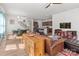 Open layout combining living, dining, and kitchen with hardwood floors, modern furniture, and plenty of natural light at 12110 Anne Blount Aly, Huntersville, NC 28078