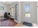Bright home office space features an ergonomic chair, desk, and a view to the exterior through large windows at 12110 Anne Blount Aly, Huntersville, NC 28078
