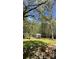 Expansive backyard with a gazebo and lush lawn, ideal for outdoor enjoyment and entertaining at 1232 Rosada Dr, Charlotte, NC 28213