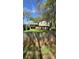 Charming home featuring a well-maintained lawn and a wooden fence, offering both beauty and privacy at 1232 Rosada Dr, Charlotte, NC 28213