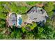 Aerial view of a luxury home featuring a beautiful backyard oasis with a pool and patio at 12627 Ninebark Trl, Charlotte, NC 28278