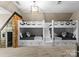 Charming bedroom featuring built-in bunk beds with a unique playhouse for imaginative adventures at 12627 Ninebark Trl, Charlotte, NC 28278
