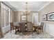 Elegant dining room with a chandelier, large window, and stylish decor at 12627 Ninebark Trl, Charlotte, NC 28278