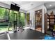 Well-equipped exercise room with glass doors, modern gym equipment, and adjacent sauna at 12627 Ninebark Trl, Charlotte, NC 28278