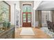 Elegant foyer with hardwood floors, high ceilings, and a view of the outdoors at 12627 Ninebark Trl, Charlotte, NC 28278