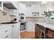 Close up of a modern kitchen with built-in stainless steel appliances and wood flooring at 12627 Ninebark Trl, Charlotte, NC 28278