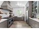 Beautiful kitchen with stainless appliances, custom cabinets, large farmhouse sink, and great natural light at 12627 Ninebark Trl, Charlotte, NC 28278