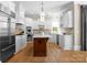 Spacious kitchen with stainless steel appliances, a center island, and custom cabinets at 12627 Ninebark Trl, Charlotte, NC 28278