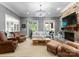 Inviting living room with a stone fireplace, comfortable seating, and elegant decor at 12627 Ninebark Trl, Charlotte, NC 28278