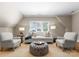 Comfortable living room with vaulted ceiling, neutral walls, and window shutters at 12627 Ninebark Trl, Charlotte, NC 28278